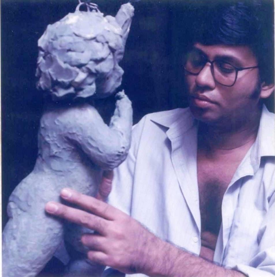 A young Shahid Hussain with a clay model